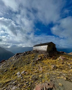 “The wind shifts cold, a sudden bite,
The skies grow heavy, stealing light,
At Caroline Hut, by Aoraki’s side,
We wait as winter swells its tide.”
“The mountains stand, their faces bleak,
Whispers of snow in silence speak,
A storm unfolds, wild and deep,
As nature wakes from autumn’s sleep.”
“The howling wind, the icy flare,
The crisping air, a frigid prayer,
Yet here within this timbered space,
We watch the storm with steady grace.”
“Snowflakes dance in frenzy high,
A curtain drawn across the sky,
While in this hut, we find our peace,
The world outside begins to cease.”
“The hearth glows warm, the candles flicker,
Each breath a cloud in winter’s quicker,
As Aoraki stands, majestic, cold,
A silent witness, proud and bold.”
“Through windows blurred with falling white,
We wait as stars reclaim the night,
Until the storm gives way to dawn,
And winter’s reign has finally drawn.”
📸 @elke_mountain_guide
Pics 1 & 2 were taken just 24 hours apart and show the dramatic transition from autumn to winter. 40cm of snow fell with a cold southerly front and transformed the landscape around Caroline Hut.
#NZWeather #SouthernAlps #AutumnToWinter #SnowStorm #WinterIsHere #FreshSnow #CarolineHut #BallPass #MountaineeringCourse #MountainSkills #Aoraki #AorakiMountCook #AorakiMountCookNationalPark #MountainHike #MountainGuide #NZMountains #WeAreIFMGA #NZMGA The Best Day Hikes & Walking Trails in Aoraki Mount Cook - Ball Pass Summit Trek - #288